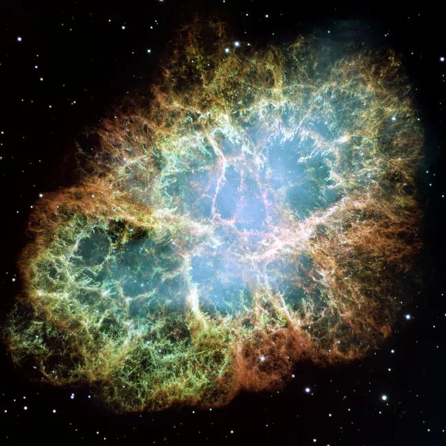 蟹状星云的合成图像，这是一个超新星遗迹，预示着一颗非常大质量恒星的死亡。NASA/ESA/ASU/J